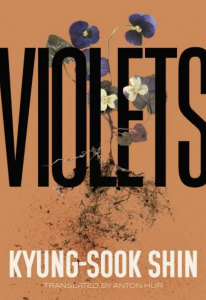 Cover of Violets by Kyung-sook Shin, featuring a black title with several intertwining violets on an orange background.