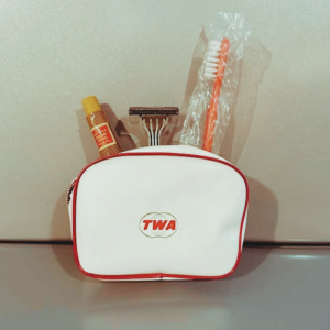 Image from The Keepthings, June 2023, featuring a white toiletries back with the letters "TWA" in red.