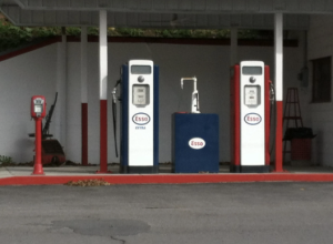 Banner image of One Art, featuring a red and white old-timey gas pump.