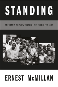 Cover of Standing: One Man's Odyssey During the Turbulent '60s by Ernest McMillan, with a black-and-white photograph of a group of Black people in the 1960s linking arms and singing or speaking.