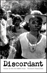 Discordant by Richard Hamilton featuring a black and white photograph of a Black woman in a crowd wearing a hat and sunglasses.