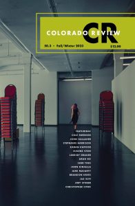 Colorado Review Volume 50, Issue 3 featuring photography of a woman in a black dress’s figure turned towards a doorway with stacks of red chairs surrounding the room.
