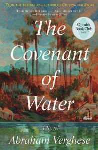 The Covenant of Water by Abraham Verghese featuring detailed artwork of a woman kneeling near an oasis with a desert and palm trees in the background.