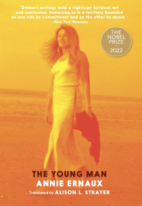 The Young Man by Annie Ernaux featuring a monochrome yellow photograph of a woman in a long skirt walking along the beach.