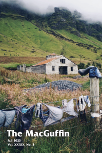 Cover of The MacGuffin with a photograph of a barn behind hanging laundry.