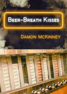 Cover of Beer-Breath Kisses by Damon McKinney, featuring white text in a neon orange border and a photograph of white and orange candy bars inside a silver vending machine. 