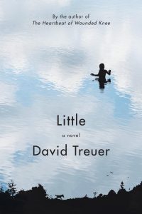 Cover of Little by David Treuer, featuring black text and an illustration of a child’s silhouette standing in a body of water that is reflecting a blue sky, white clouds, and black outlines of trees. 