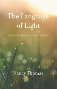 Cover of The Language of Light by Nancy Thomas, featuring a close-up photograph of blades of grass with dew on them in the sunlight.